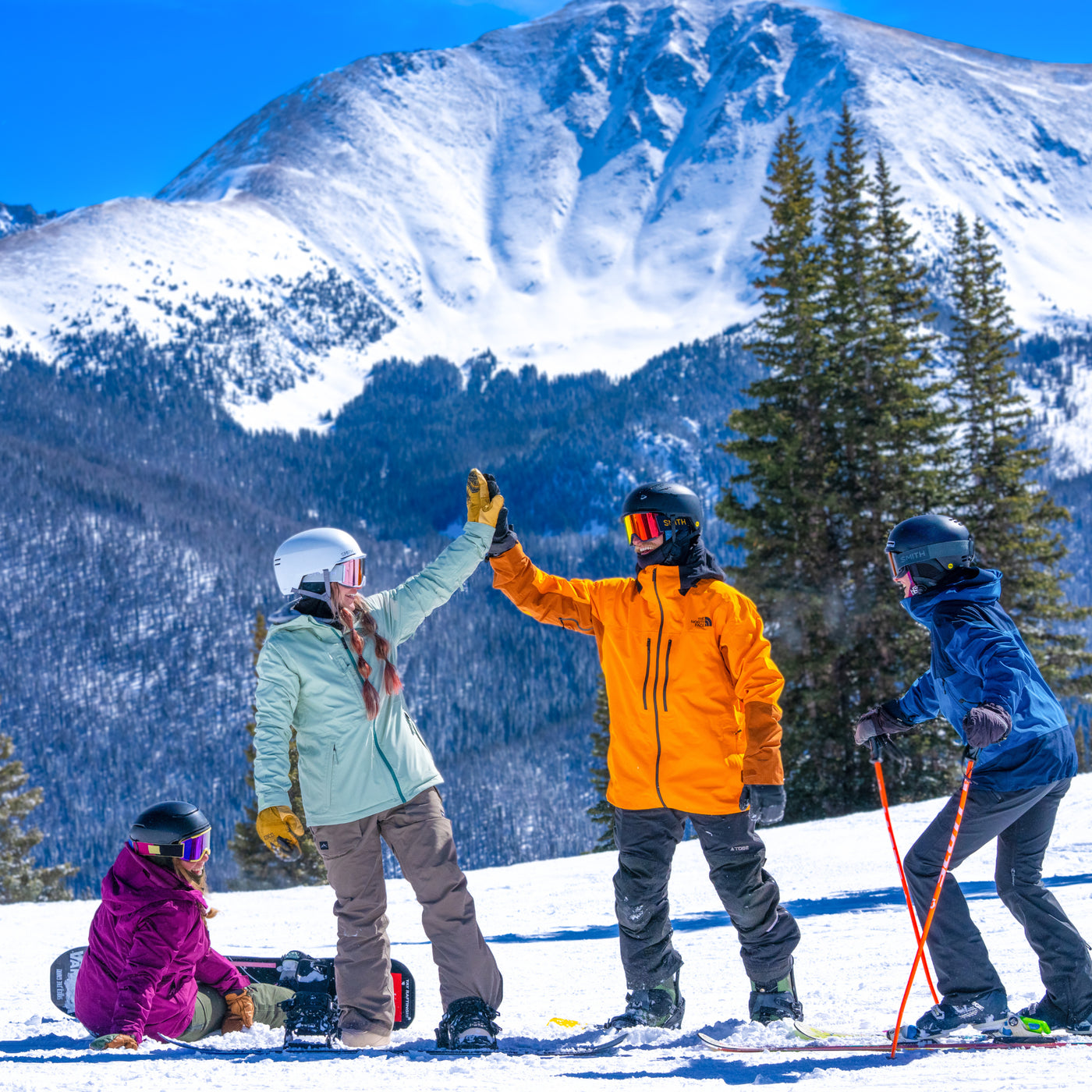 Skiers looking out over the Parry's Peak view above Winter Park, Colorado