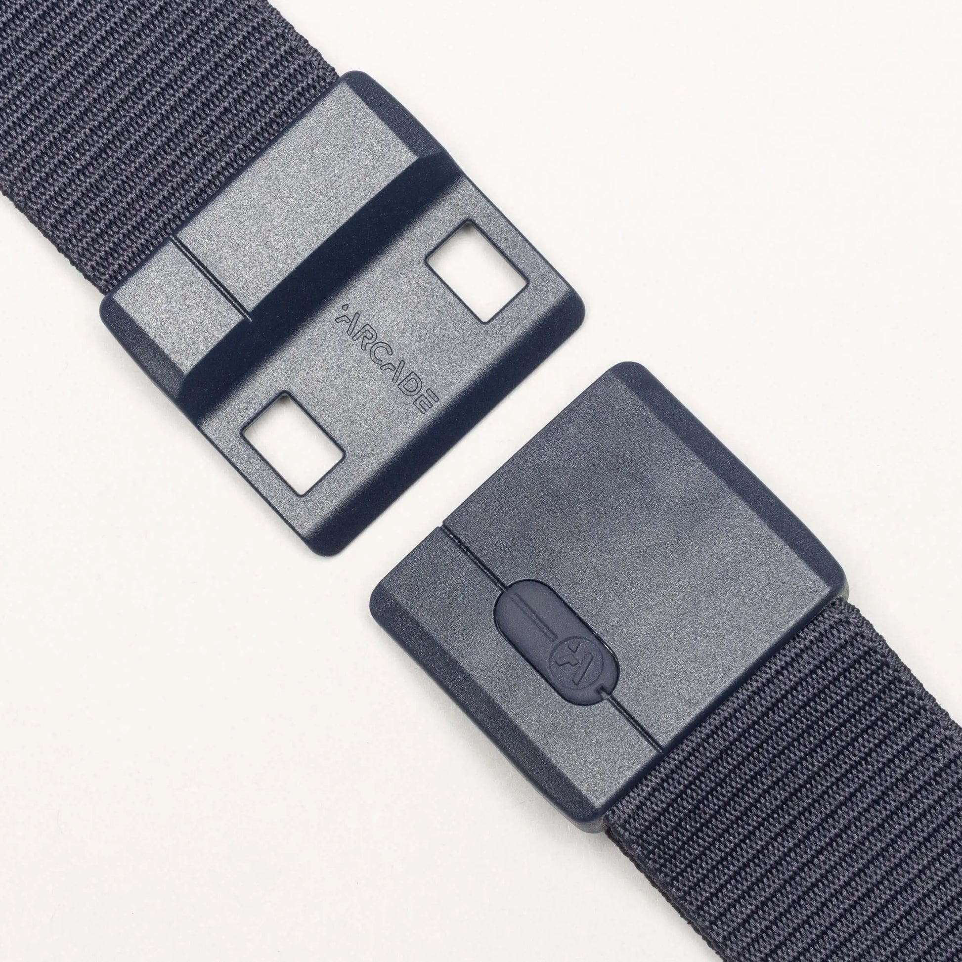 Gray belt with a plastic buckle on a white background | XSports