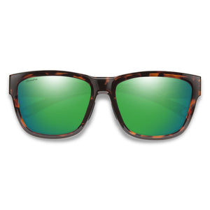Sunglasses with green lenses and tortoiseshell frame on a white background
