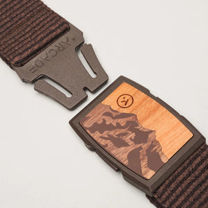 Brown belt with wooden buckle on a light gray background | SXSports